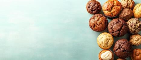 Assorted Muffins Arrangement on Light Blue Surface. Gluten-free low-carb desserts concept. photo