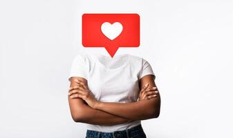 A person stands with arms crossed, featuring a large heart icon instead of their head. This artistic interpretation symbolizes online interactions and emotional connections in social media culture. photo