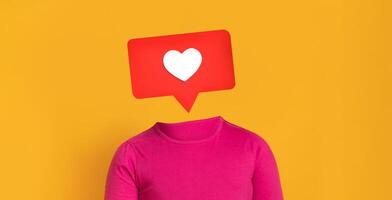 A vibrant yellow backdrop highlights a pink shirted figure with a speech bubble featuring a heart symbol. This illustration represents social media interaction and engagement. photo