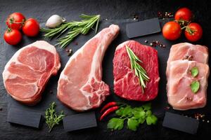 Butcher showing variety of fresh raw meat cuts with herbs and spices photo