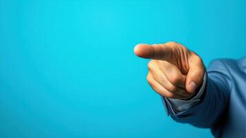 Hand gestures against a blue background indicate a call to action during a presentation or discussion in a professional setting photo