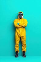 Individual in protective gear stands confidently against a vibrant turquoise backdrop showcasing safety measures in health and environmental protection in a modern context photo