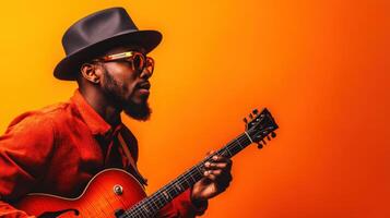 Musician performing with guitar against vibrant orange backdrop showcasing talent and style in an urban setting photo