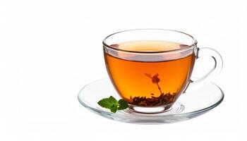 A transparent glass cup filled with aromatic tea sits on a saucer, complemented by a sprig of fresh mint on white. photo