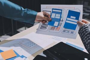 A person holding a piece of paper with a blue and white design on it photo