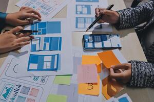 A group of people working on a website design photo