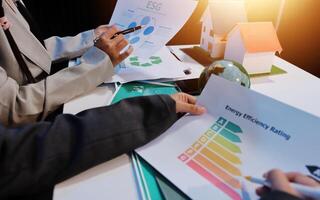 Business people working on energy efficiency report photo