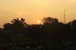 A sunset over a field photo