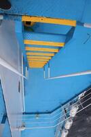 A blue boat with a ladder on it photo