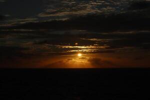 A sunset over the ocean photo
