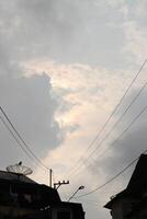 A cloudy sky with a few clouds photo