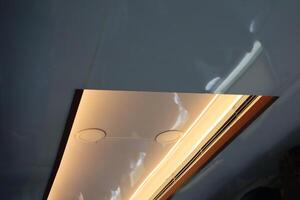 A light is shining down on a ceiling photo