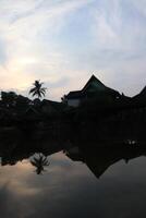 A reflection of a building in the water photo