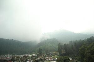 A view of a village in the mountains photo