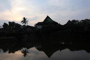 A reflection of a house in the water photo