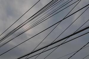 A view of the sky with many wires photo