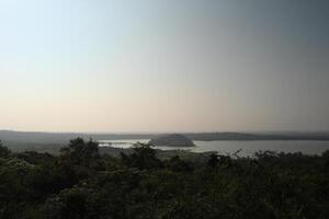 A view of a lake and a forest photo
