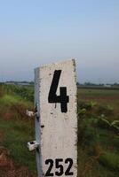 A white sign with a number on it photo