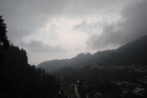 A cloudy sky over a mountain town photo