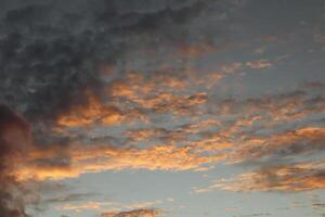 A plane flying in the sky with a cloud photo