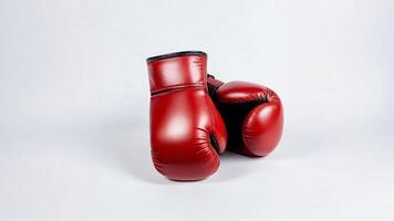Red boxing gloves on white background. photo