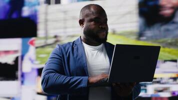 High tech black user connecting on web platforms with vibrant digital interfaces and data visualizations, showcasing mobile networking engagement. Social media web experience. Camera B. video