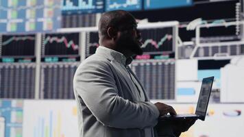 Male business leader analyzing finance charts and analytics for startup development, performance models for fruitful management decisions. Administrator studying big data reports. Camera B. video
