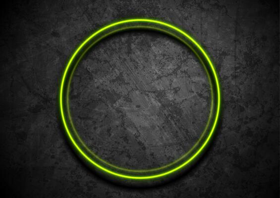 Green neon luminous circle frame on dark grunge wall abstract background