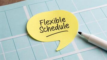 Flexible working. Flexible schedule yellow speech bubble planner with marker, promoting work, hybrid, work from home ,remote ,work life balance photo