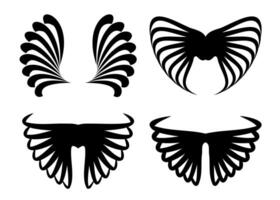Four abstract wing silhouettes set isolated on white background vector