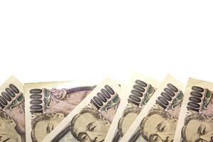 money yen banknote on white background, business and finance concepts photo