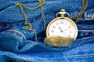 Image Of Blue Jeans Denim Texture And Vintage Pocket Watch photo