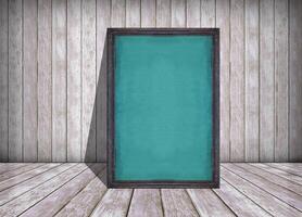 chalkboard in frame and old wooden wall, texture and background, background for design with copy space for text or image. photo