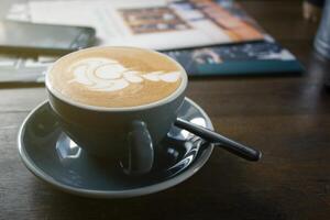 Art-shaped pattern of coffee latte art, With a relaxing time. photo