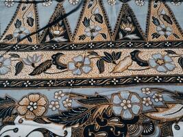 close up of a black and gold patterned fabric photo