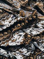 background pattern featuring motifs commonly found in Javanese batik. The pattern is symmetrical and abstract, and can be used on fabric, clothing, artwork, or wrapping paper designs photo