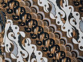 background pattern featuring motifs commonly found in Javanese batik. The pattern is symmetrical and abstract, and can be used on fabric, clothing, artwork photo