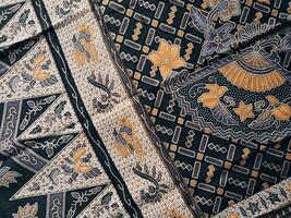 A black and gold patterned fabric with pattern photo