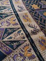 a close up of a colorful and intricate pattern on a bedspread photo