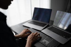 Engineer installing Hardware coding on a laptop computer photo