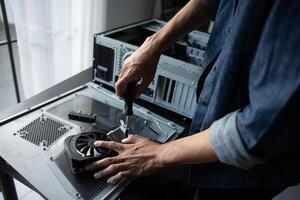 a Engineer installing Hardware fixing a computer case photo
