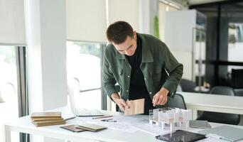 Architecture interior Man is working on a project at a desk photo