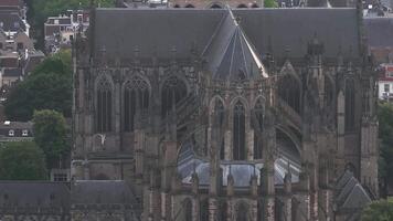 Aerial view of Utrecht, Netherlands, highlighting the Dom Tower, Gothic architecture, urban layout, and a mix of modern and historic buildings. video
