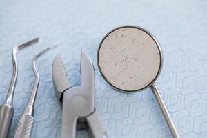 Dental tools and instruments on a blue surface photo