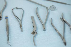 surgical instruments and tools for operation on a blue background closeup photo