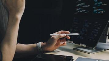 A person is working on a computer with a pen in their hand video