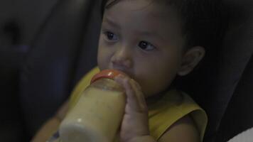 Toddler Is Drinking Milk From A Bottle. video