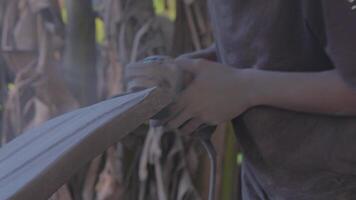 Crafting a traditional weapon in the heart of the jungle during the day video