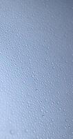 blue wet surface covered with a large number of water photo