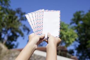 woman shows the envelope to be distributed on the day of Eid photo